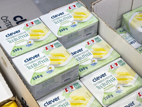 Austrian butter packaging display in grocery store aisle