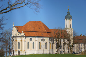 The Wieskirche, a UNESCO-listed Rococo pilgrimage church in Bavaria, Germany, set against a scenic alpine landscape.