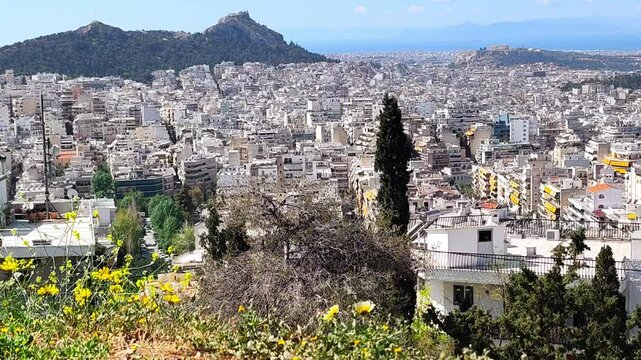Panoramic view of Athens, Greece from the top of the Attiko Alsos, a hilltop park near the Polygono neighborhood.