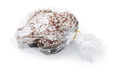 Colomba Pasquale, traditional Italian dessert in transparent cellophane packaging isolated on white background.