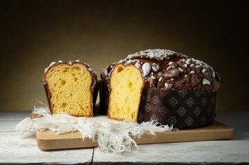 Colomba Pasquale, traditional Italian dessert on wooden table, closeup, copy space.
