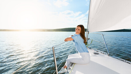 Dream Vacation. Happy Woman Sitting On Yacht Deck Smiling To Camera Enjoying Sea Ride On Sailboat...