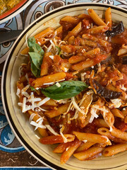 Sicilian Penne Pasta with Tomato Sauce, Eggplant, Cheese, and Basil