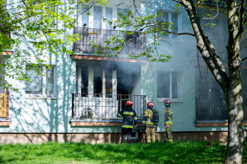 Firefighters are bravely battling a major residential blaze in an urban area, showing skill