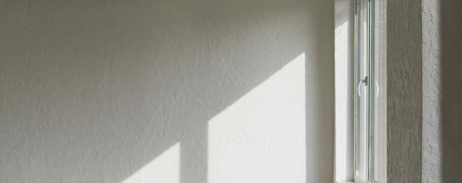 Sunlight falls through the window opening