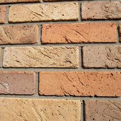 Generative AI of a high-resolution close-up image of a brick block texture, front view. The image captures the detailed surface of the bricks, including rough textures, subtle color variations.