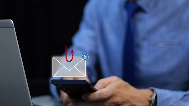 Businessman receiving messages on his phone during a phishing attack. 3D email animation
