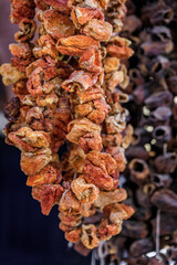 Wrinkled sundried red bell peppers hang bazaar market in Istanbul, Turkey