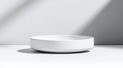 White Ceramic Bowl Minimalist Studio Setting High-key Lighting Front Center View Smooth Matte Finish Product Display Bright White Background Clean Modern Aesthetic Ideal for Home Goods Ads