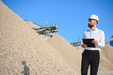 An engineer at a crushed stone or gravel plant. Stone mining