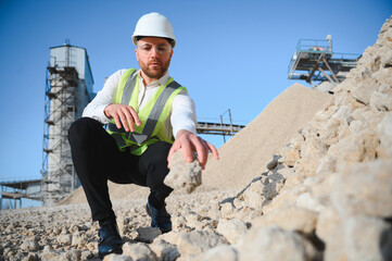An engineer at a crushed stone or gravel plant. Stone mining