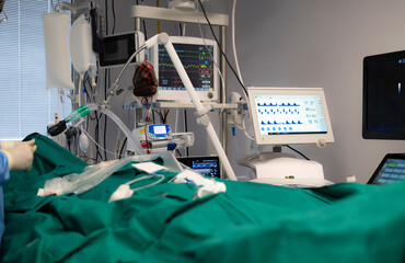 Medical equipment monitoring patient vitals during surgery in operating room