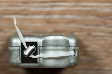 Abstract closeup macro shot of dental floss with a shallow depth of hand and copy space