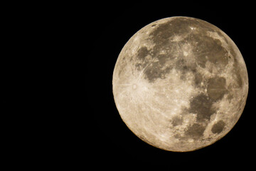 The Full Moon is when the Sun and the Moon are aligned on opposite sides of Earth and approximately 100% of the Moon's face is illuminated by the Sun