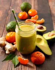 Avocado Ginger Citrus Smoothie with Fresh Ingredients on Rustic Table