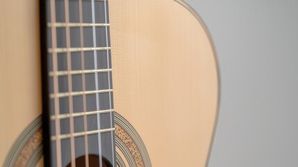 Obraz premium Close-up of acoustic guitar neck and body. Wooden fretboard and soundhole