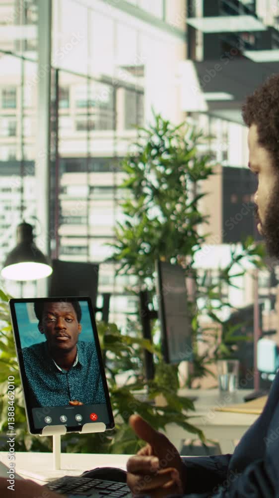 Poster vertical video manager chatting with worker in videoconference, setting goals for performance and co