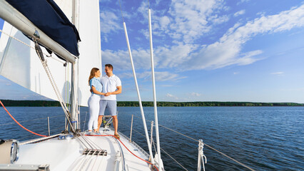 Boat Tour. Couple Dating On Yacht, Hugging Standing On Deck Sailing In Turquoise Sea Outside. Empty Space
