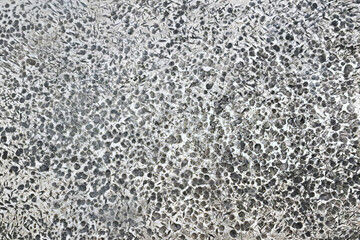 Rough metallic surface texture. Industrial steel background close up. Grunge pattern with scratches. Corroded material in detail. Cold gray texture with worn marks. Abstract hard surface look.