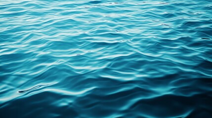 Obraz premium Reflective water surface with subtle waves in azure blue. Water background