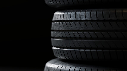 Closeup Layered arrangement of car tires in a vertical stack. Suitable for warehouse, garage, or car service. 3d render.