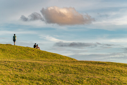 Peaceful moment of travelers watching sunset in Lombok, Indonesia