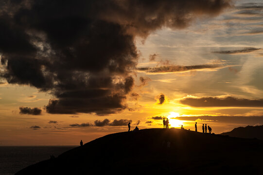 Golden hour on the hill with friends and phones, Lombok, Indonesia