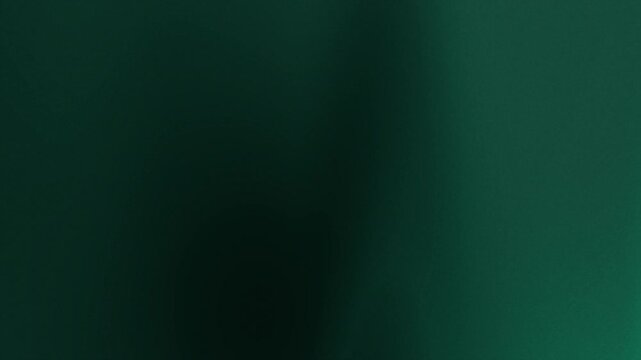 Dark green abstract background with blurred gradients moving across a dark surface