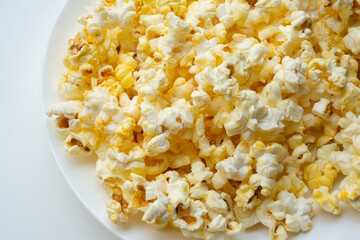 Tasty popcorn close up background top view