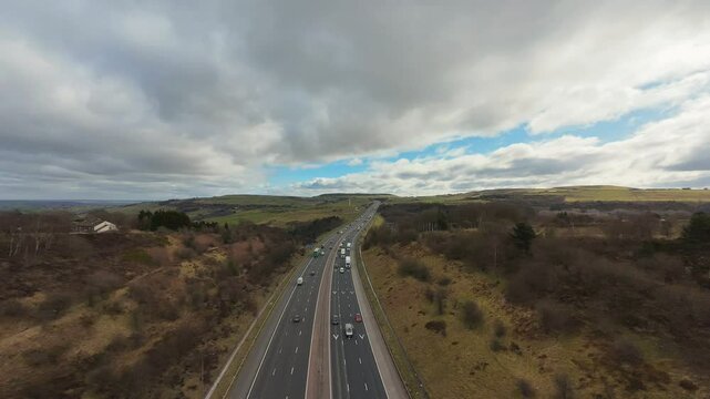 Timelapse and cloud-lapse shot of the traffic on the M62 Motorway at Scammonden, England