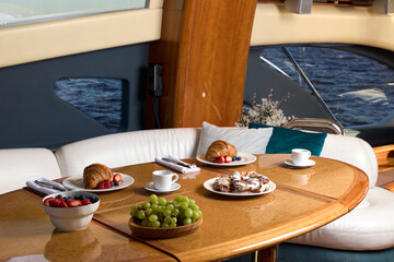 An Elegant Breakfast Setup on a Beautiful, Luxury Yacht with Stunning Amenities and Views