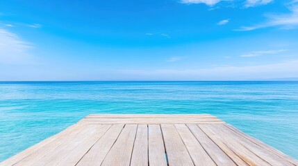 Fototapeta premium Tranquil wooden dock over turquoise ocean with clear blue sky