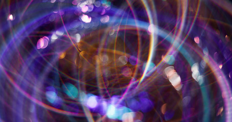 Neon circles. Defocused shiny sparkler. Purple color gleaming particles lens flare motion on abstract bokeh light blurred modern background.