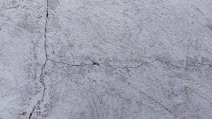White wall cement broken texture with cracks Background.