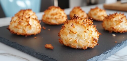 Cookie crumbs in spiral pattern on slate surface, surrounded by broken cookie pieces.