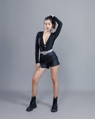 Asian Model in Elegant Black Outfit with Dynamic Pose