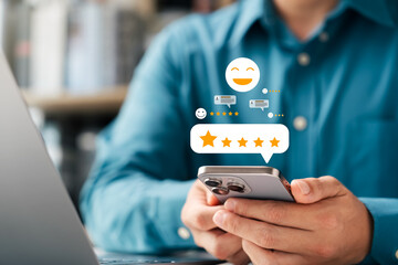 Customer satisfaction survey, customers use smartphones to give 5-star ratings with happy smiles via online applications, giving excellent service and product quality ratings, ranking business.