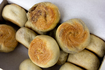 Bakpia pathok , Indonesian Traditional Cake with Chinese Influence. It made from a mixture of green beans, cheese and sugar, which is wrapped in flour, then baked.