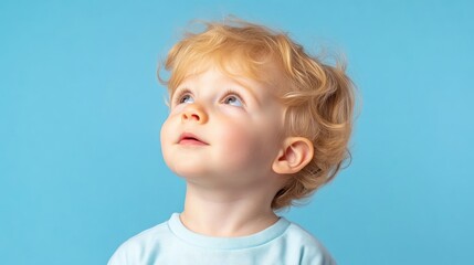 Naklejka premium Adorable toddler gazing upward