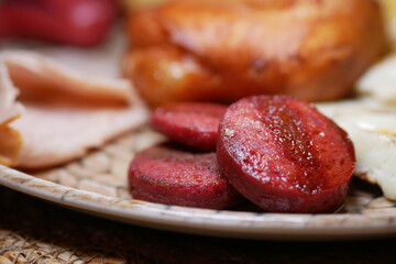 Delicious grilled sausage served on a rustic plate during breakfast