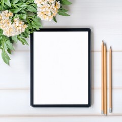 Blank Tablet Screen with Pencils and Flowers on White Wooden Table