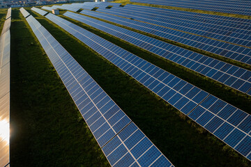 Solar farm with rows of panels on field, highlighting renewable energy's role in reducing pollution and supporting a sustainable future