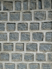 A rough and cracked earthy surface,
featuring a mix of concrete-like texture. The natural
tones of brown, beige, and tan emphasize the arid,
aged look.