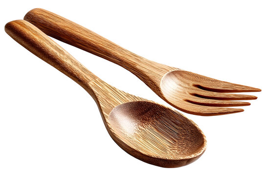 Artisanal handcrafted wooden serving spoon and fork on dark background
