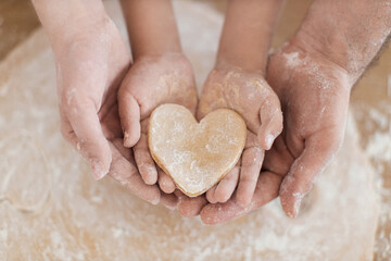 Caucasian family preparing cookies together showcasing bonding, collaboration, and wholesome indoors activity.