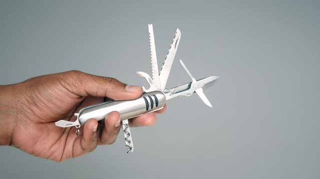 Handheld multi-tool showcases various functions and features