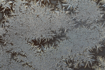 Macro Frost Patterns on Window Glass in Winter Morning Light