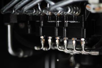 Close-Up of Industrial Machine with Precision Tubing and Bolts in Manufacturing Environment