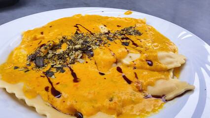 Pumpkin ravioli on a white plate