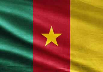 Cameroon flag with fabric texture and vibrant colors waving, ideal for patriotic and cultural themes.